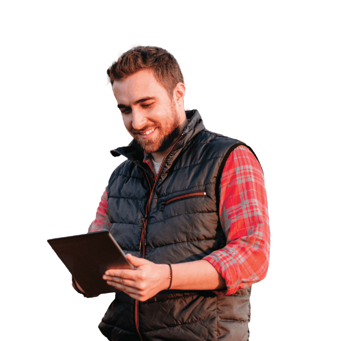 Farmer holding a tablet using g3 SmartSell